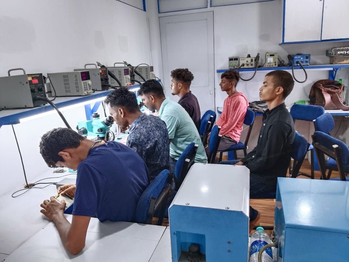 Students at their repair benches